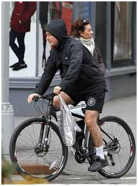 Alec Baldwin riding his bike