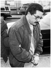 Anthony Casso in hand cuffs