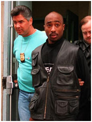 Tupac Shakur in hand cuffs
